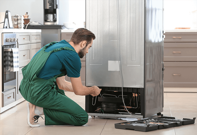 Samsung certified refrigerator repair technician in Dubai showing official certification and brand-specific training