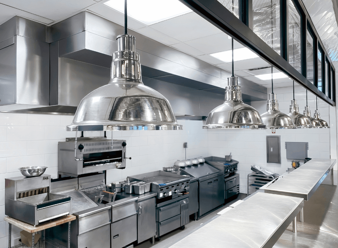 Commercial cooking equipment repair service in Dubai for restaurants and hotels with technician servicing commercial range and grill