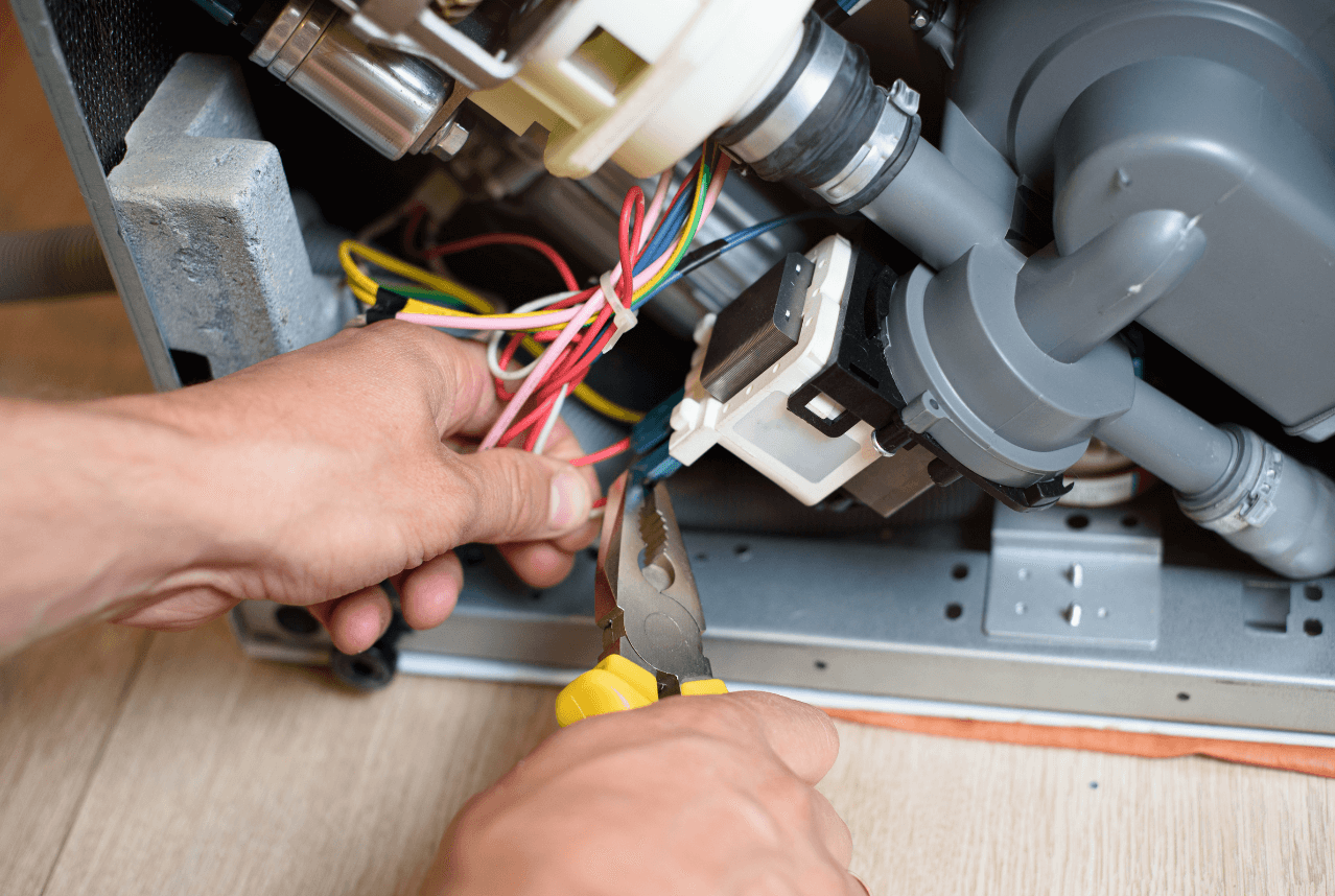 Dishwasher drying system repair showing wet dishes and heating element inspection in Dubai