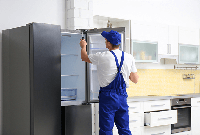 LG refrigerator repair specialist in Dubai fixing linear compressor with factory-certified tools and equipment