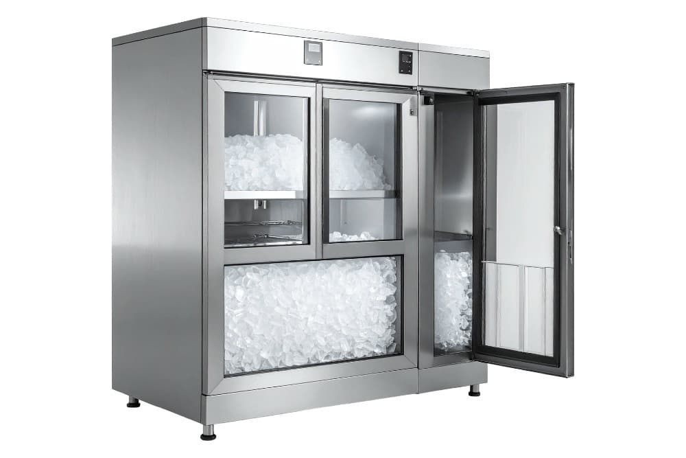 Large stainless steel commercial ice storage unit with one door open, showing ice stored inside and in the lower bin